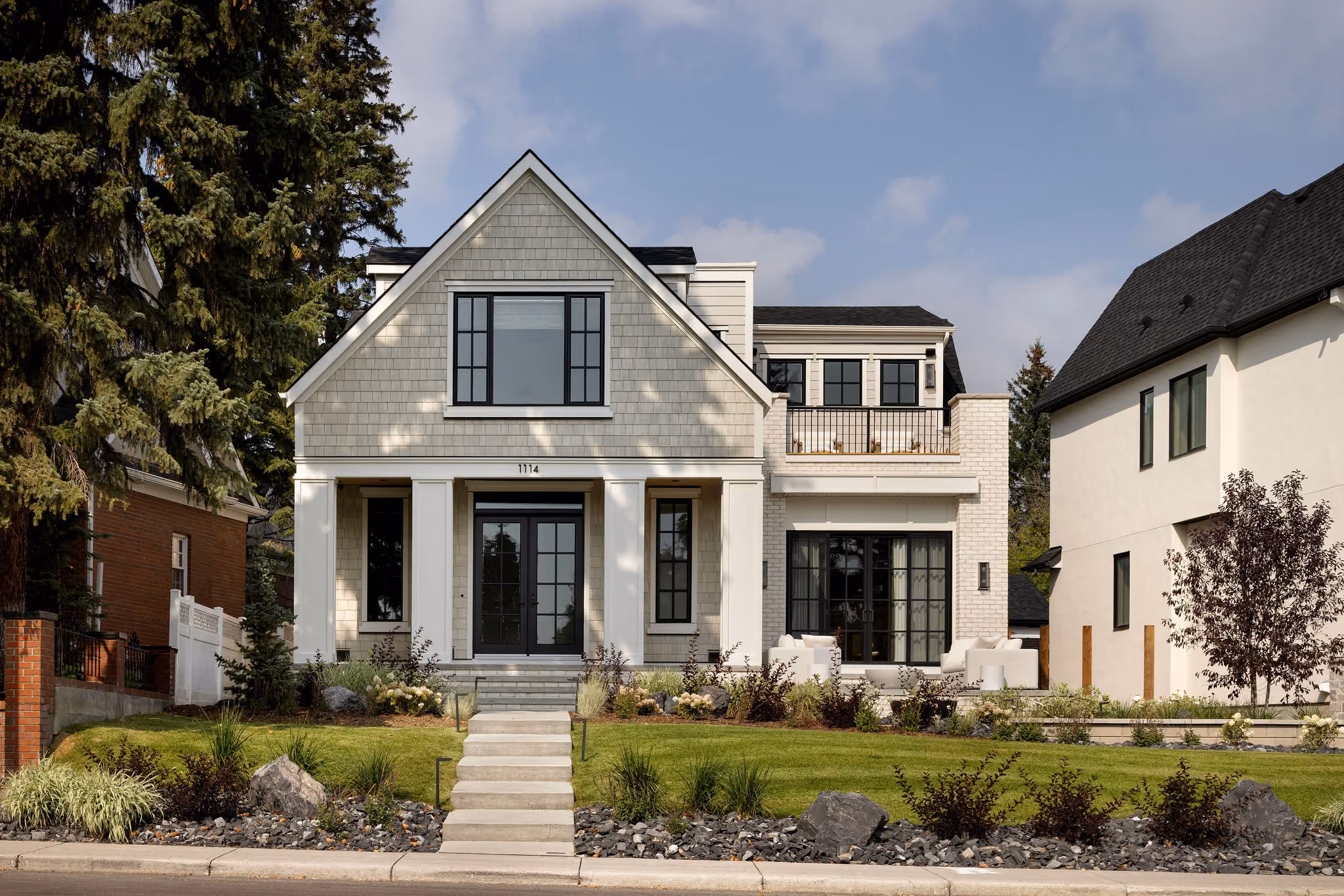 Front exterior with shingle gable and covered porch
